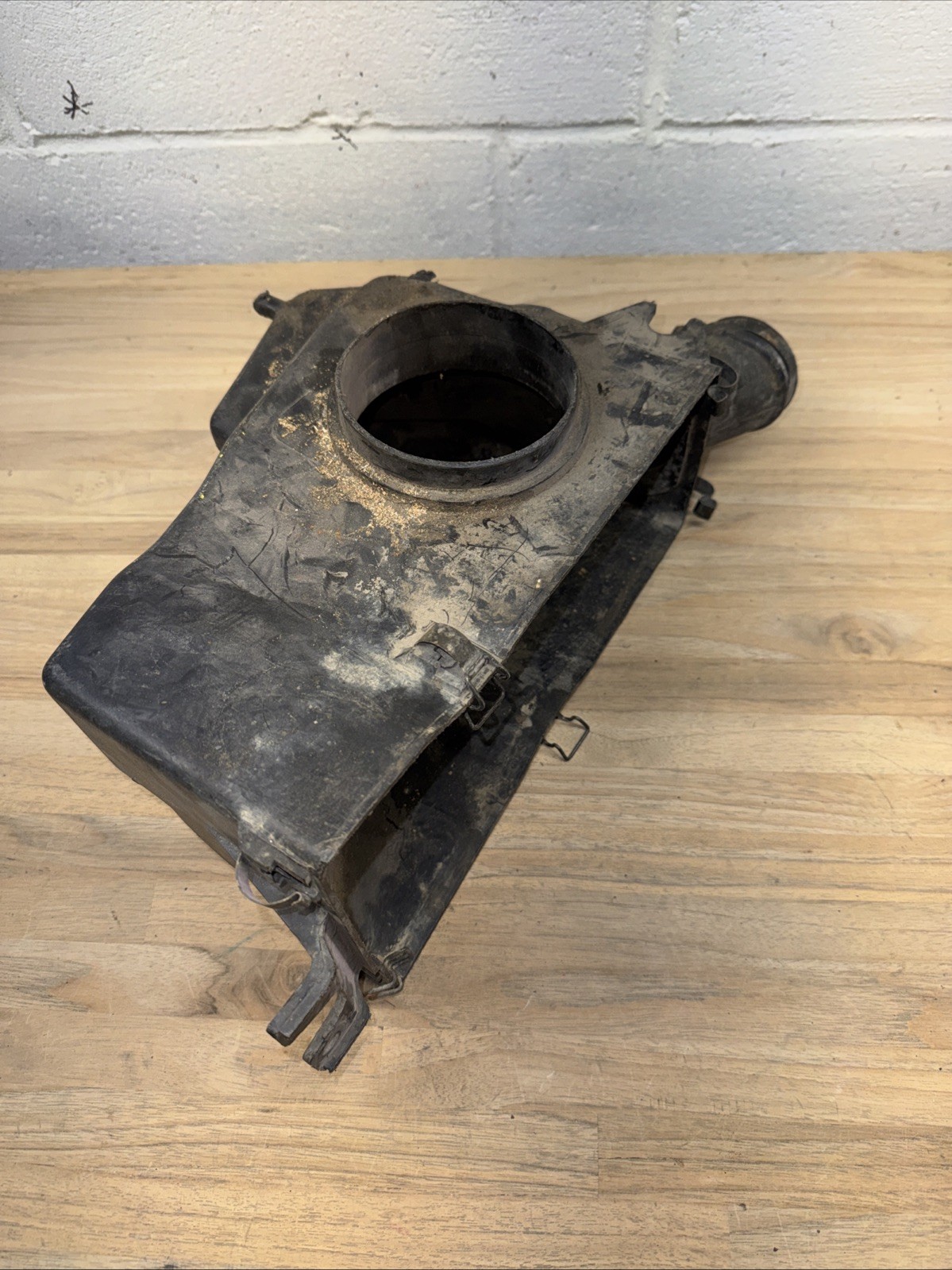 Used vintage ATV airbox / intake housing. Exact make/model unknown.